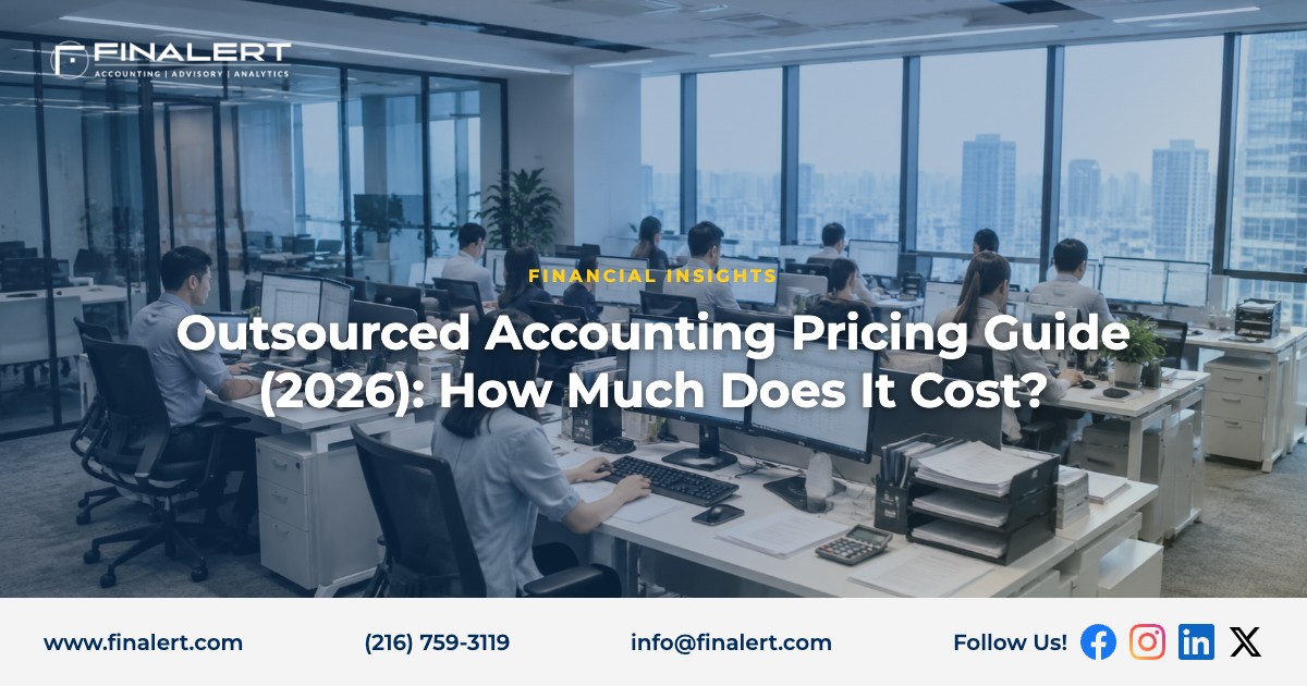 Outsourced accounting team working at desks in a modern open-plan finance office